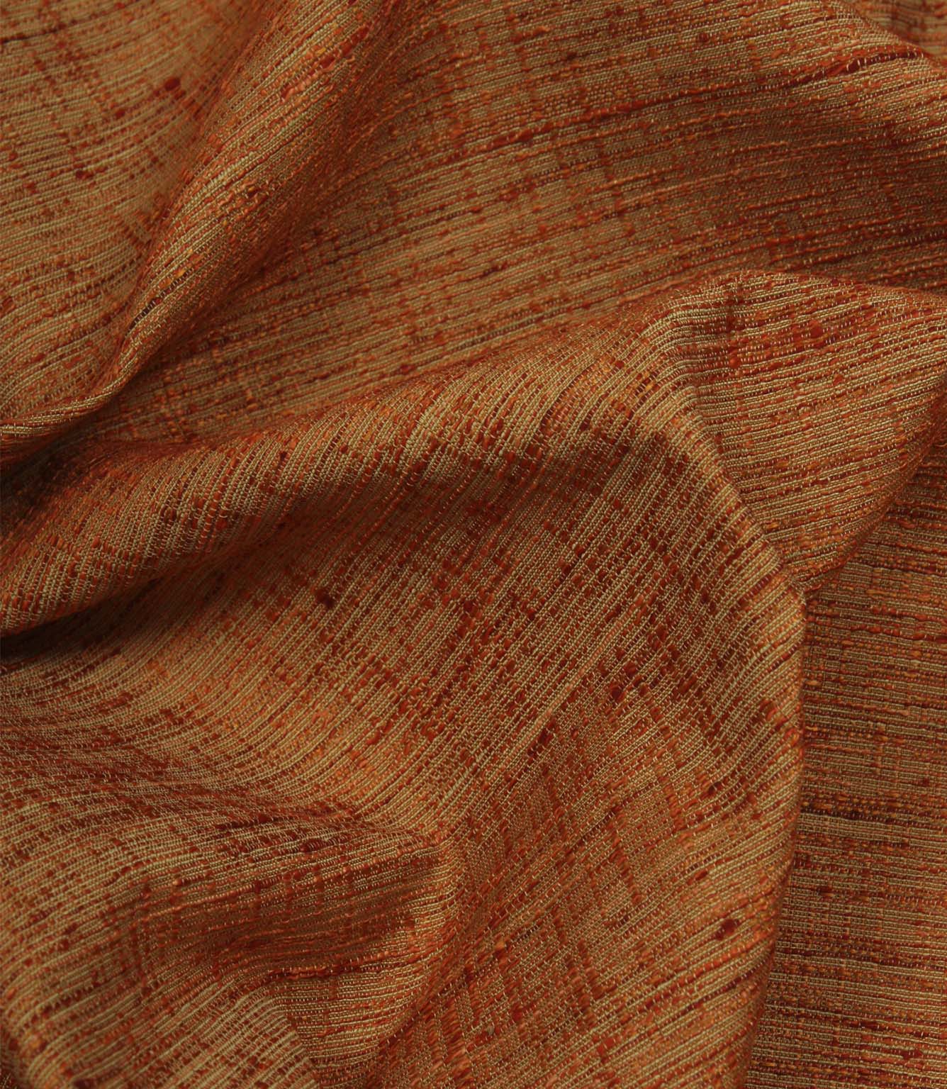 Otaru contemporary woven fabric in sunset orange draped in soft folds, demonstrating its elegant movement and tactile texture.