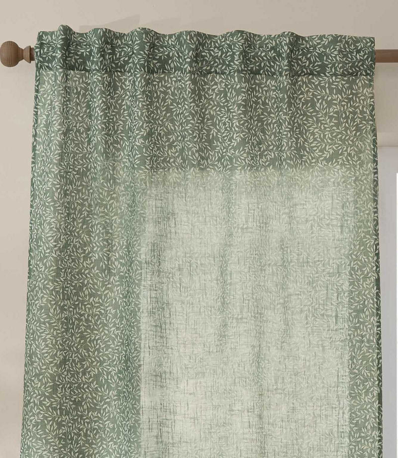 Close-up of Perrie Leaf sheer curtain in forest green and soft white, showing the gathered hidden tab top heading and small-scale leafy design.