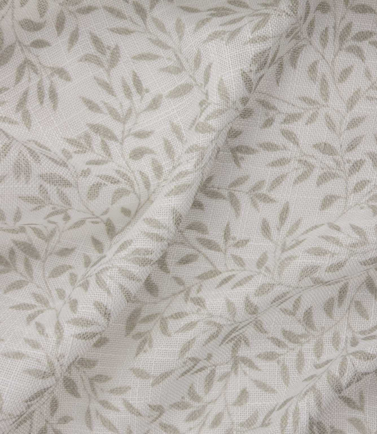 Detailed close-up of Perrie Leaf sheer fabric in natural cream and beige, showing the fine open weave and repeating trailing leaf design.