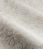 Close-up of Morris & Co Pimpernel jacquard fabric in cream and beige, showing the textured weave and detailed William Morris floral and foliage pattern.