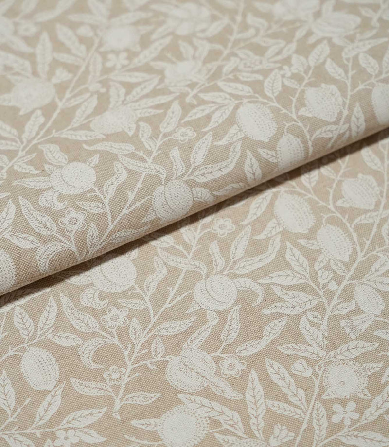 Folded Pomegranate Linen Look William Morris fabric in natural beige and cream, showing the pomegranate and leafy floral design across the linen-look surface.