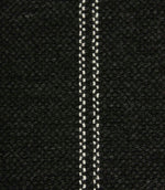 Close-up detail of black textured woven fabric featuring narrow white stitched stripe detailing.