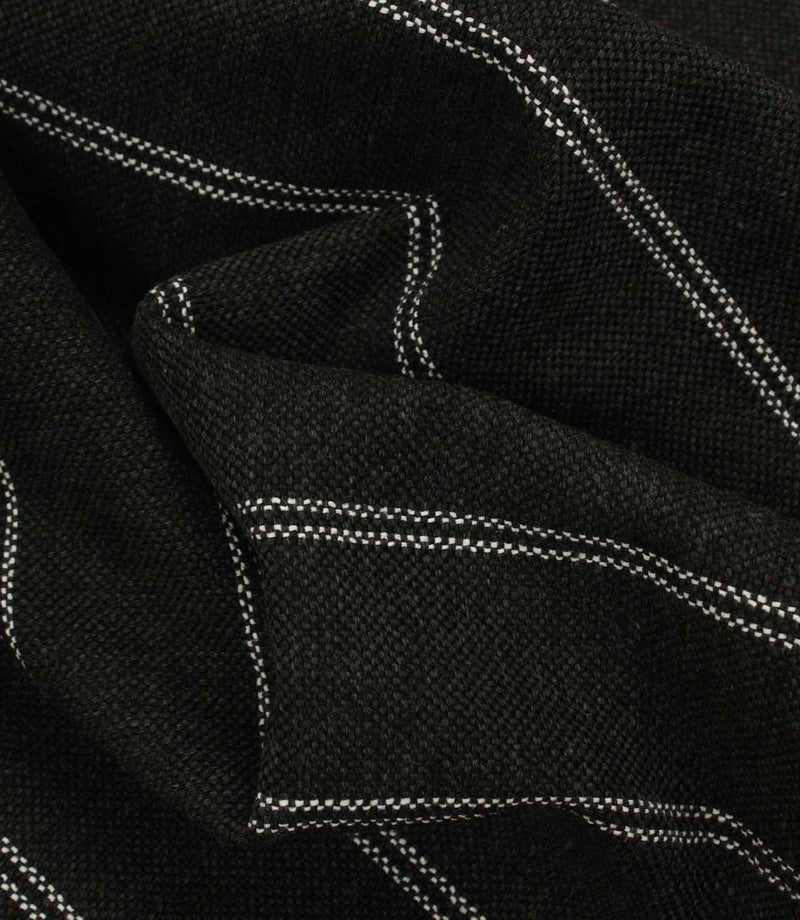 Draped black and white striped fabric with a heavyweight woven texture and soft structured folds.