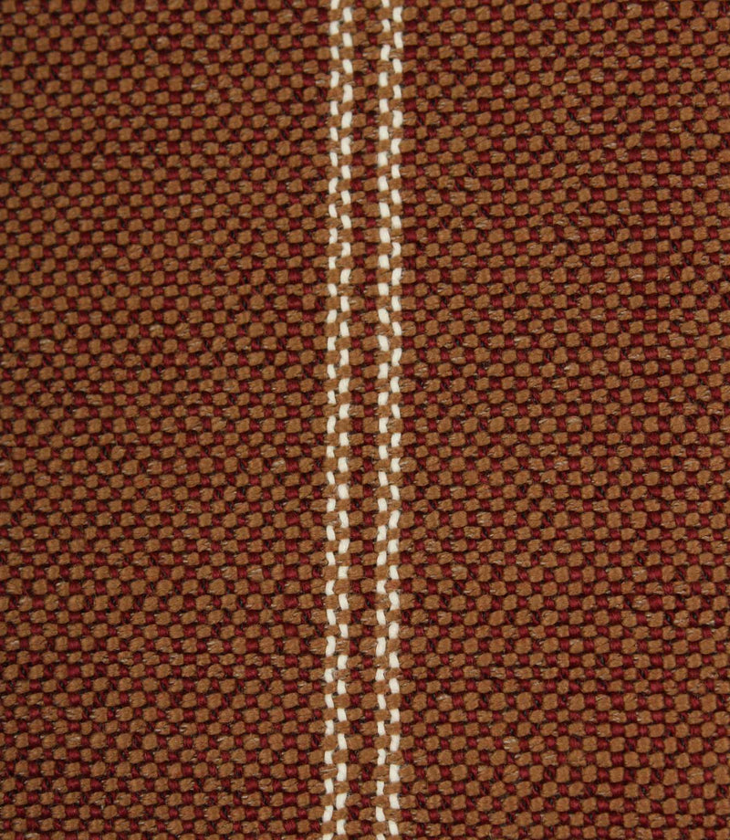 Close-up detail of copper brown textured fabric featuring narrow cream stitched stripe detailing.