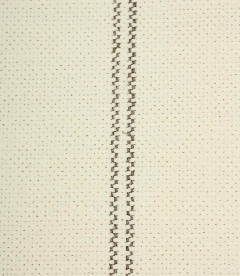 Close-up detail of ecru textured fabric featuring narrow grey stitched stripe detailing.