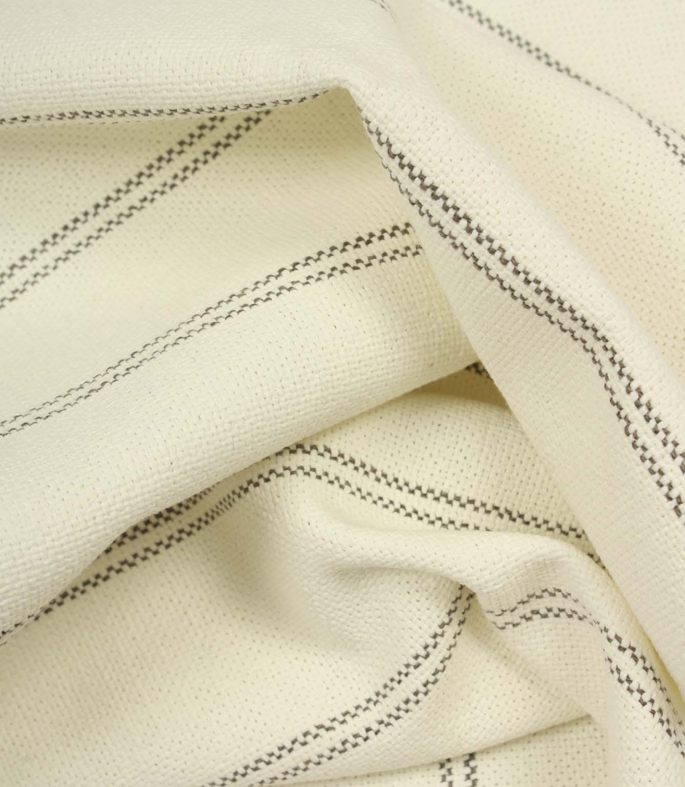 Draped ecru woven fabric with subtle grey stripe pattern and soft flowing folds.