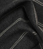 Draped ink blue woven fabric with delicate white stripe pattern and soft structured folds.