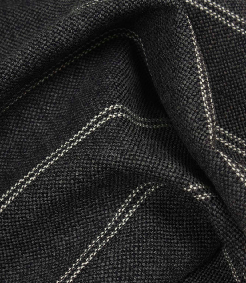 Draped ink blue woven fabric with delicate white stripe pattern and soft structured folds.
