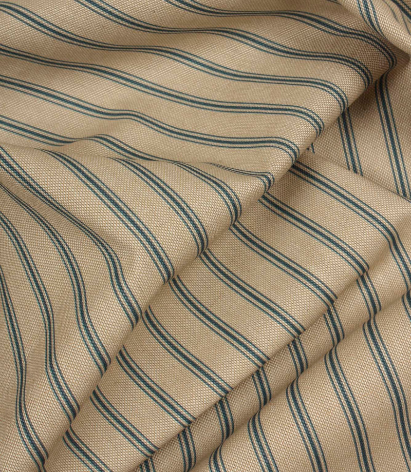 Draped striped furnishing fabric with soft beige tones and fine blue vertical stripes in a classic country style.