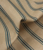 Close-up of textured woven stripe fabric showing detailed blue ticking stripes and natural-look weave structure.
