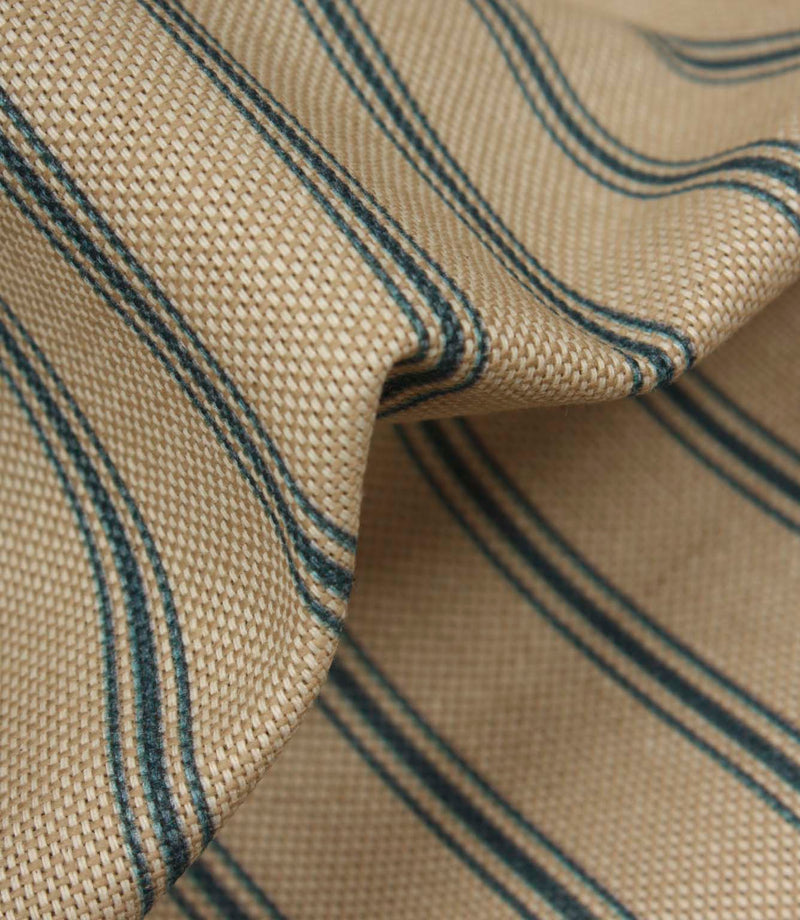 Close-up of textured woven stripe fabric showing detailed blue ticking stripes and natural-look weave structure.