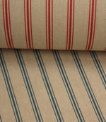 Coordinating beige stripe fabrics featuring blue and red ticking stripe colourways layered together for comparison.