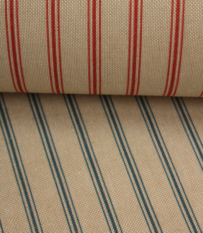 Coordinating beige stripe fabrics featuring blue and red ticking stripe colourways layered together for comparison.