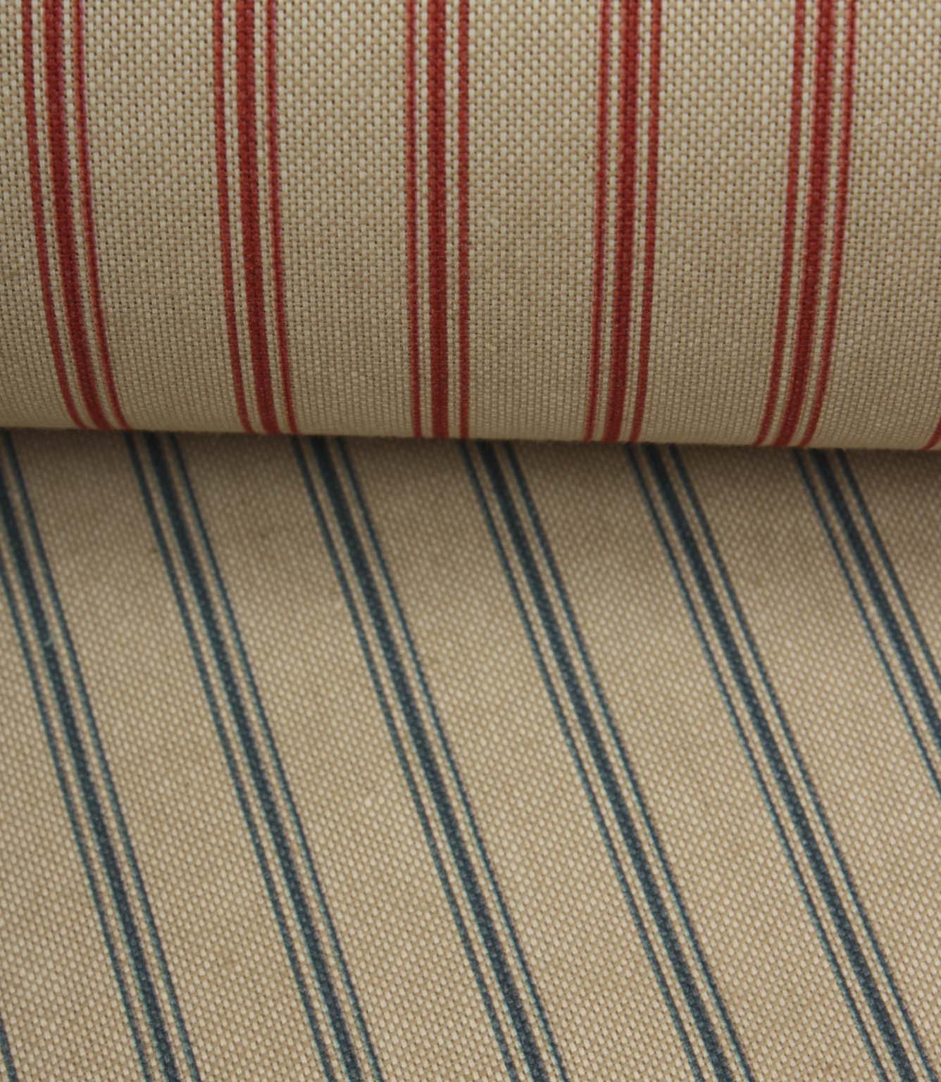 Coordinating beige stripe fabrics featuring blue and red ticking stripe colourways layered together for comparison.