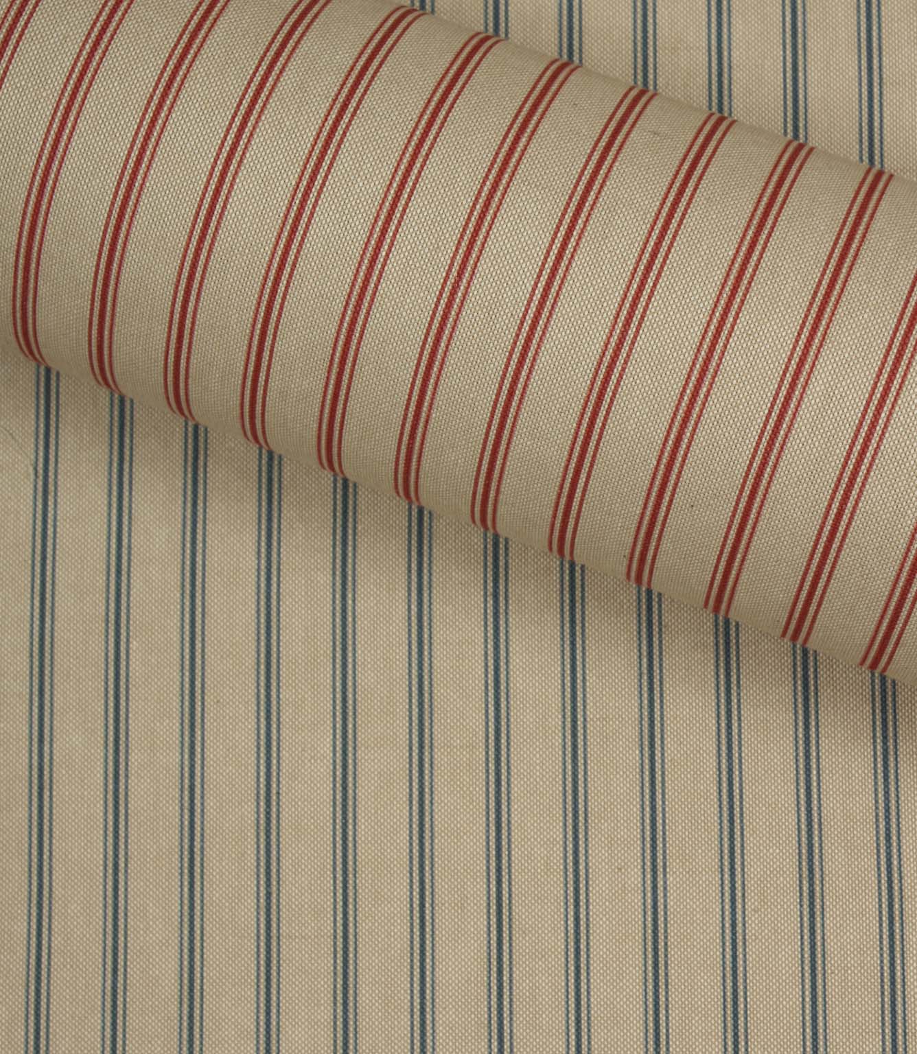 Red striped woven fabric layered over blue stripe fabric, showing contrasting ticking stripe colour options.