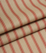 Folded beige and red striped fabric showing the scale of the ticking stripe pattern and woven construction.