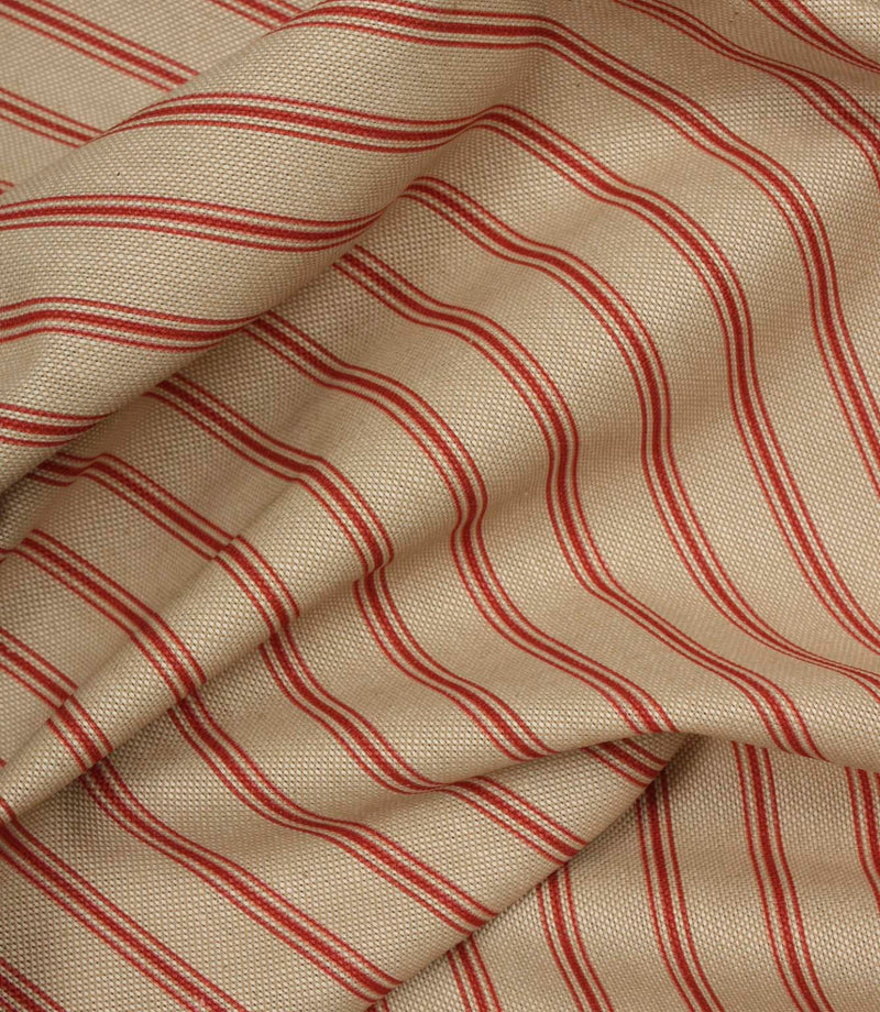 Draped neutral fabric with fine red vertical stripes in a timeless country-inspired design.