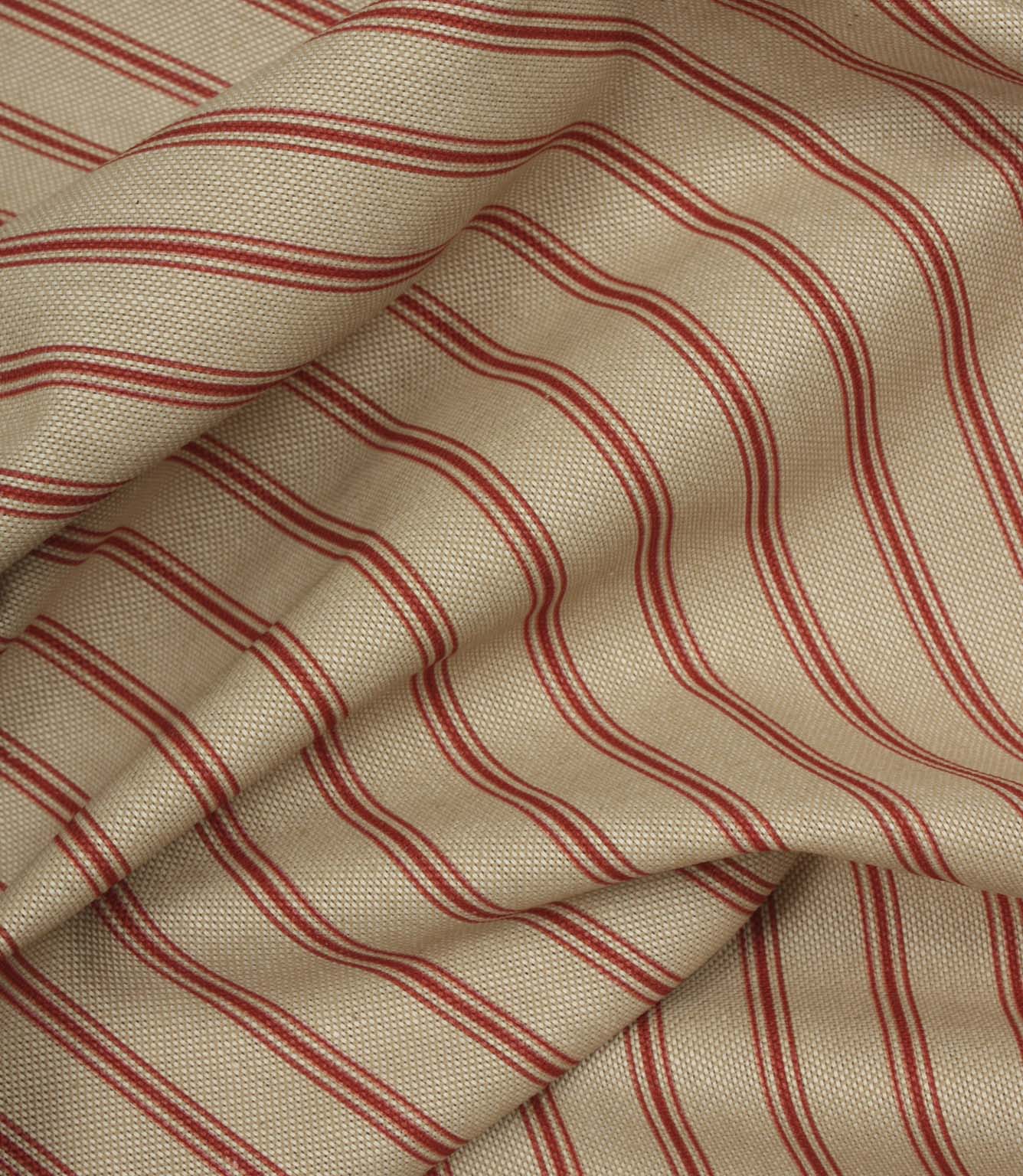 Draped neutral fabric with fine red vertical stripes in a timeless country-inspired design.