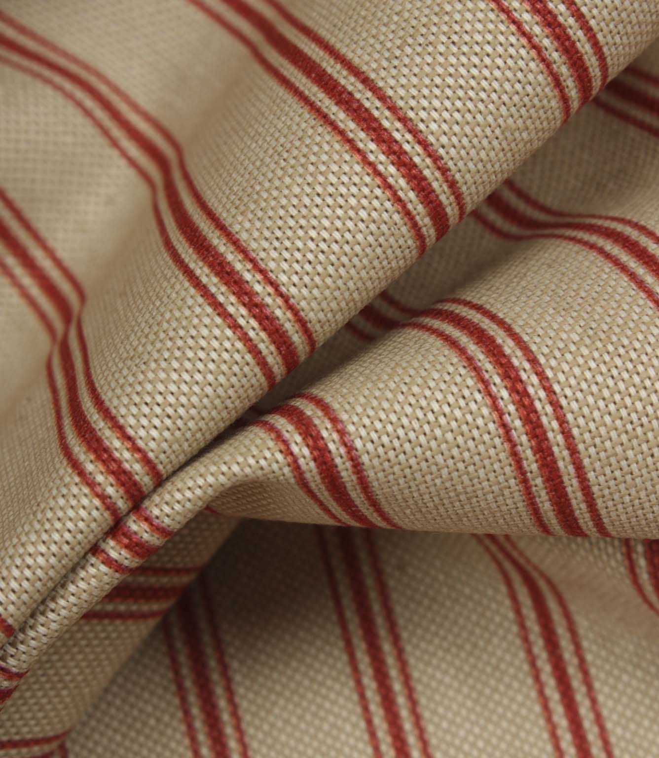 Detailed close-up of beige woven stripe fabric featuring textured weave and narrow red ticking stripes.