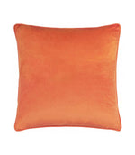 Reverse of the Pumpkin Spice velvet cushion in plain burnt orange velvet with coordinating piped edges, photographed against a white background.