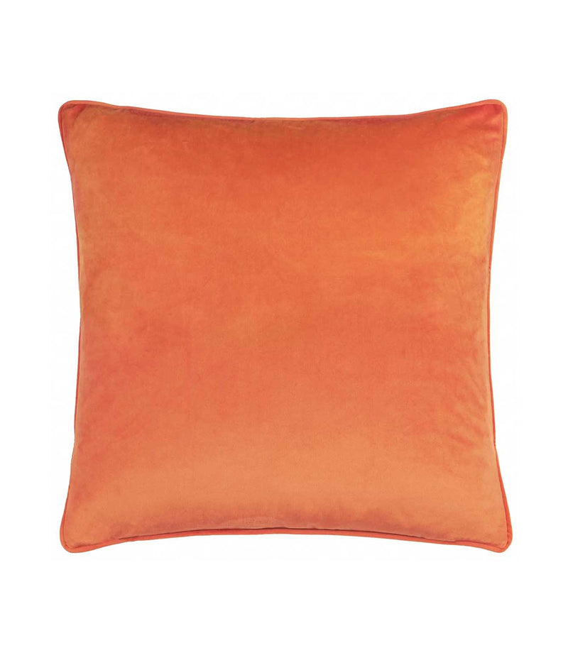 Reverse of the Pumpkin Spice velvet cushion in plain burnt orange velvet with coordinating piped edges, photographed against a white background.