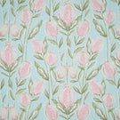 Rithani Robin's Egg fabric featuring a repeating botanical print of pink and cream pomegranates, delicate sage green foliage and slender stems on a soft duck egg blue background.