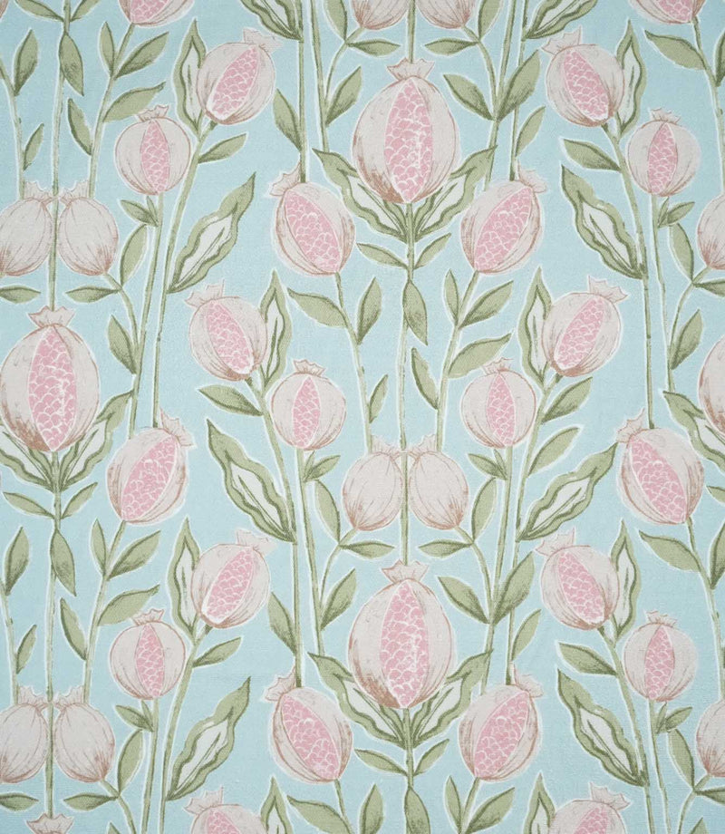 Rithani Robin's Egg fabric featuring a repeating botanical print of pink and cream pomegranates, delicate sage green foliage and slender stems on a soft duck egg blue background.