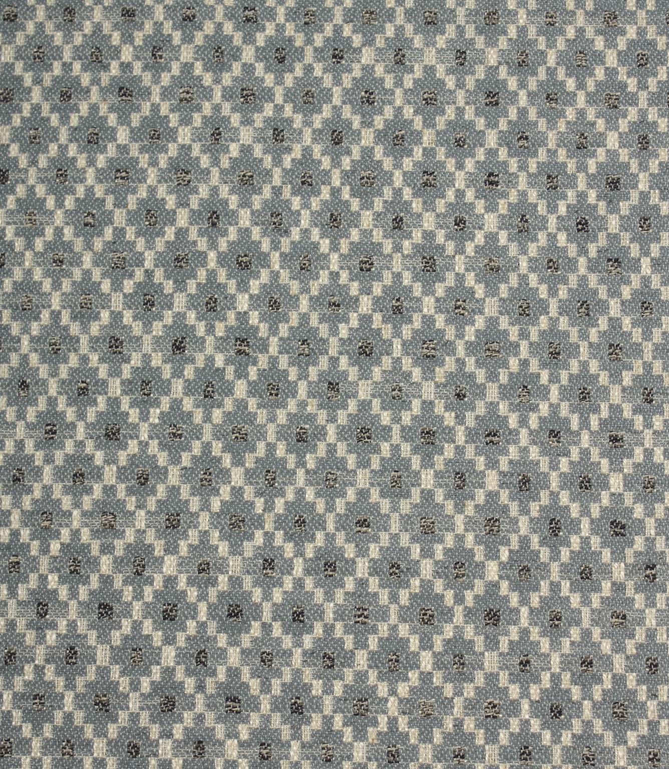 Rossini Denim fabric featuring a geometric woven pattern in denim blue, cream and charcoal tones.
