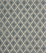 Close-up of Rossini Denim fabric highlighting the intricate geometric design and textured weave.