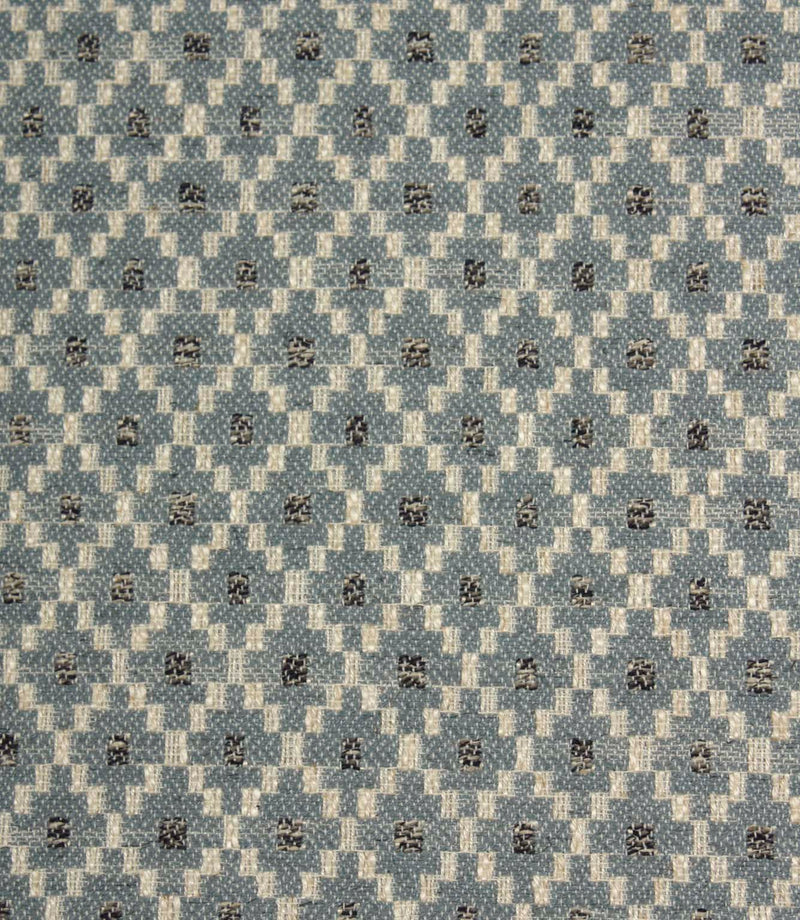 Close-up of Rossini Denim fabric highlighting the intricate geometric design and textured weave.