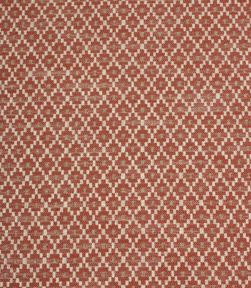 Rust red and cream woven fabric featuring a small-scale geometric pattern with soft taupe accents in a repeating lattice design.