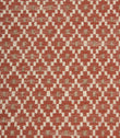 Close-up of textured upholstery fabric showcasing the intricate rust red geometric weave with cream detailing and subtle taupe highlights.