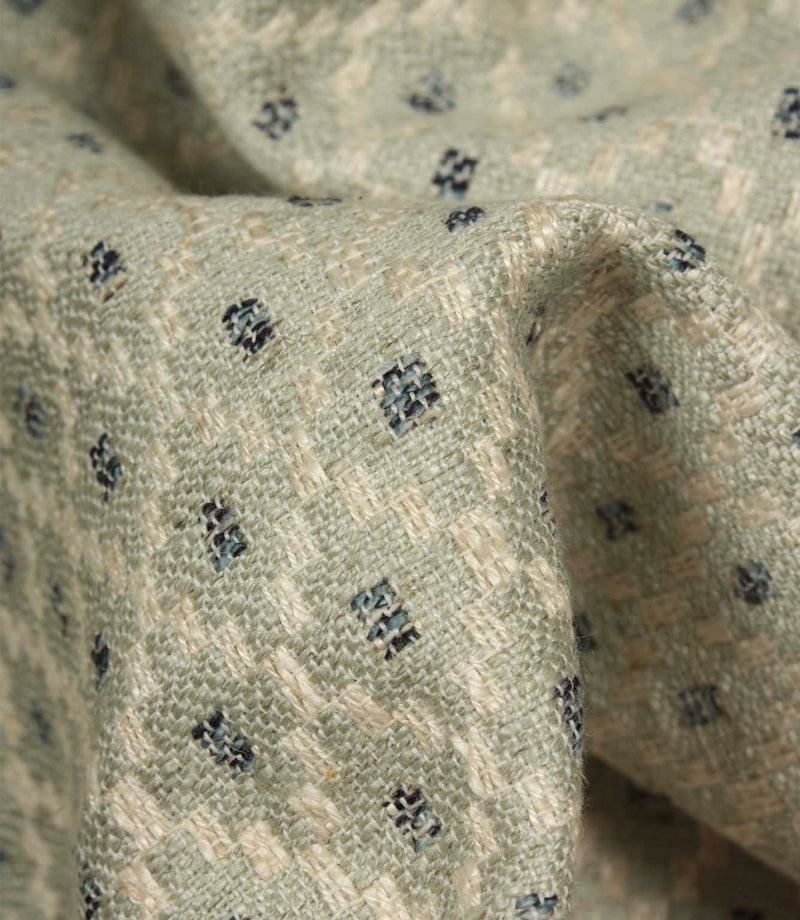 Detailed close-up of Rossini Mineral fabric emphasising the woven texture and repeating geometric design.