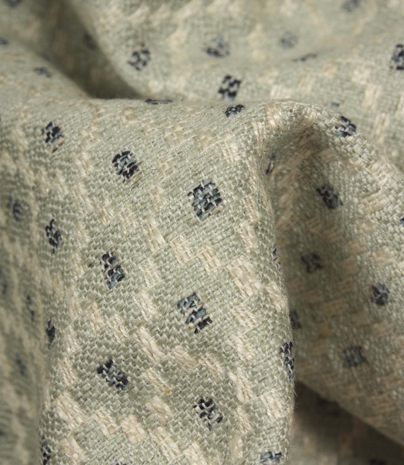 Detailed close-up of Rossini Mineral fabric emphasising the woven texture and repeating geometric design.