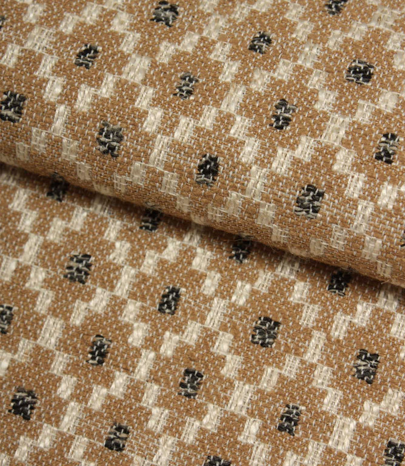 Folded Rossini Mocha fabric showcasing the intricate geometric design and upholstery-weight texture.