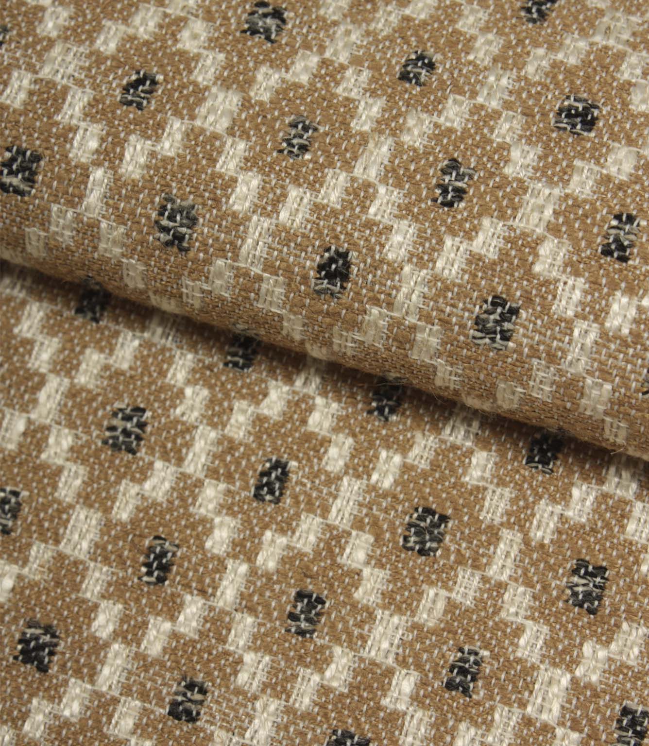 Folded Rossini Mocha fabric showcasing the intricate geometric design and upholstery-weight texture.