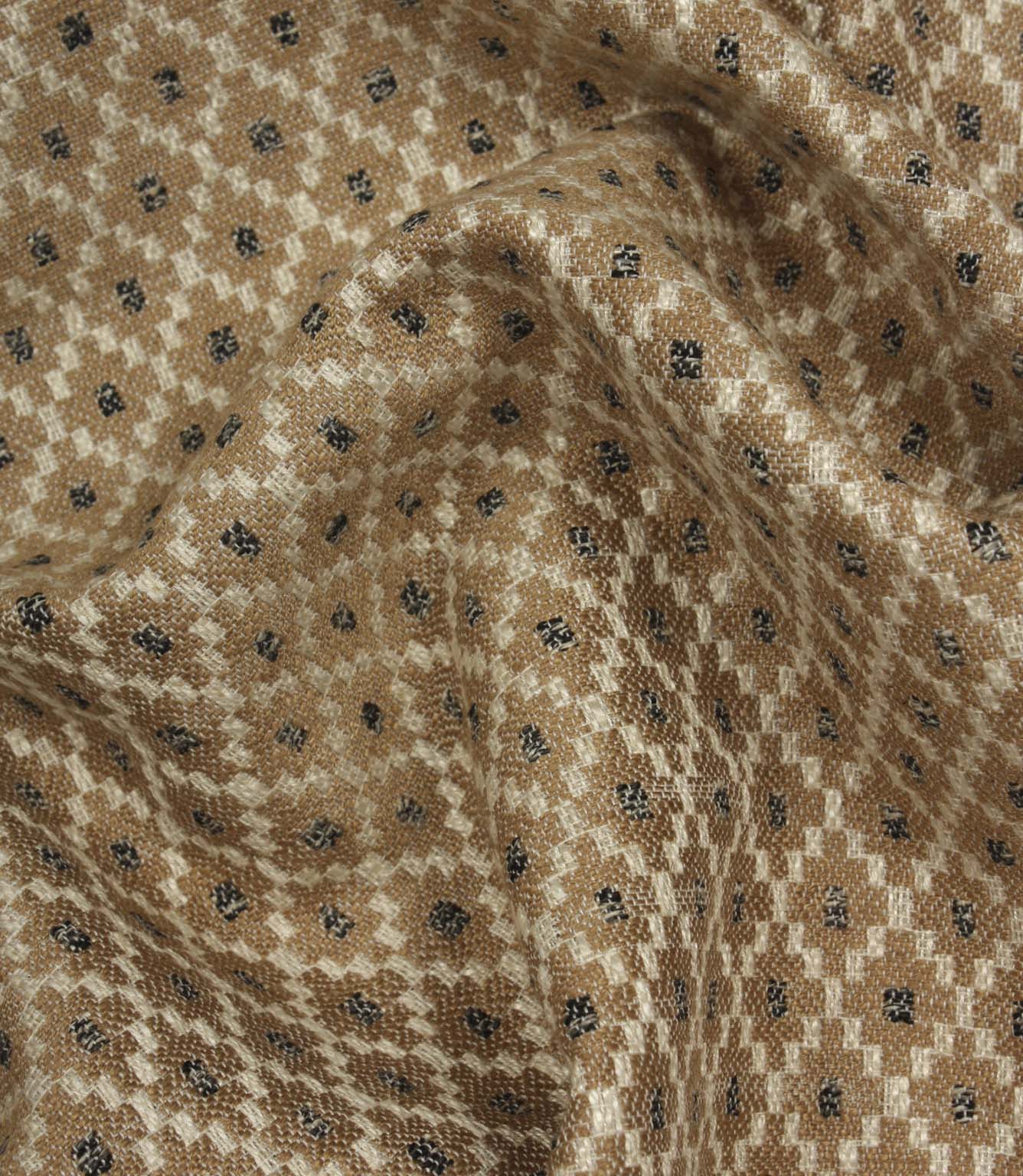 Draped Rossini Mocha fabric displaying the repeating geometric motif and soft, natural movement.