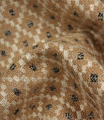 Detailed close-up of Rossini Mocha fabric emphasising the rich woven texture and geometric pattern.