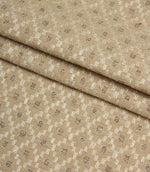Folded Rossini Natural fabric highlighting the intricate geometric design and durable upholstery-weight texture.