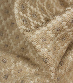 Detailed close-up of Rossini Natural fabric emphasising the rich woven texture, neutral colour palette and geometric pattern.