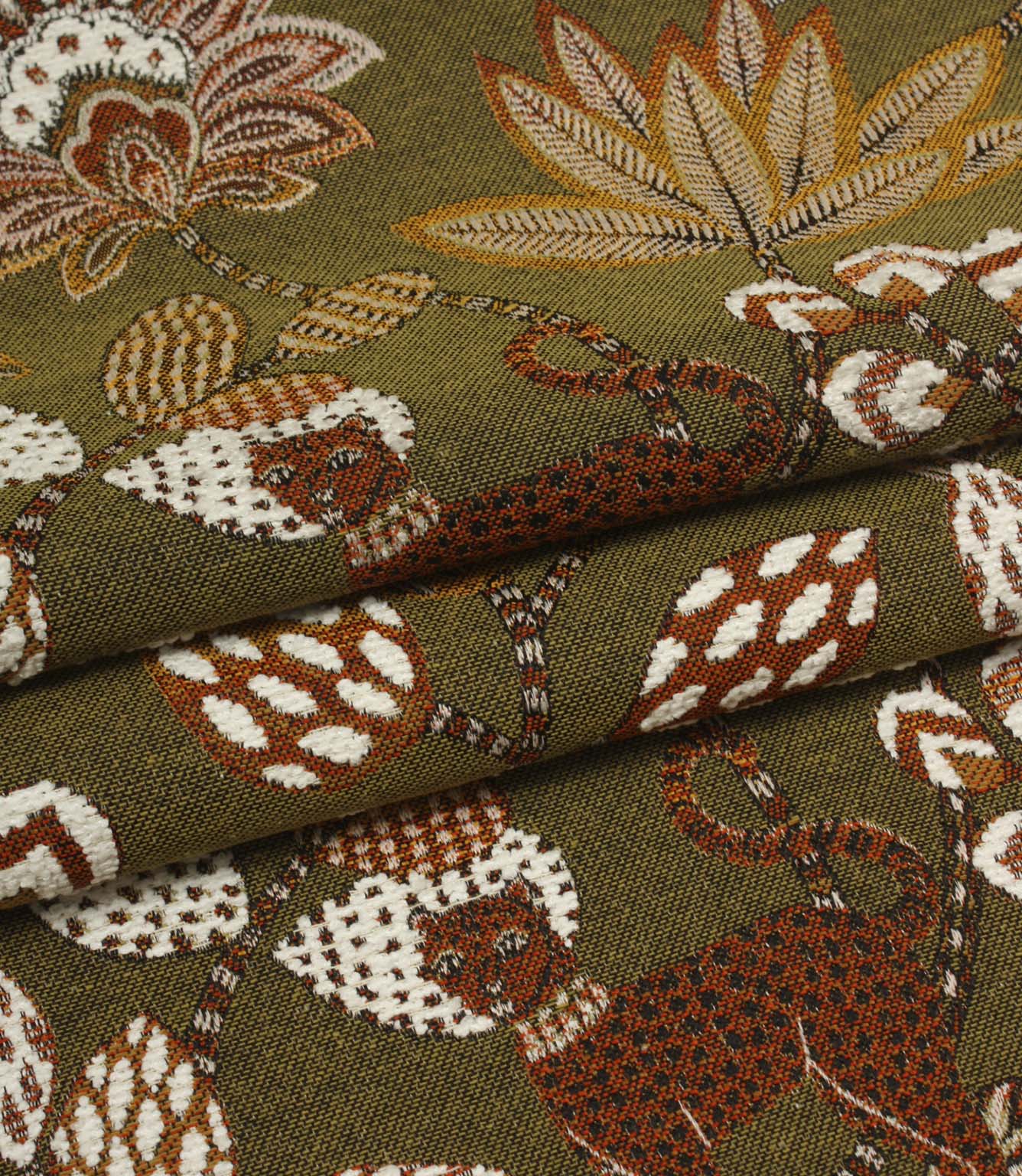 Folded olive green woven fabric featuring exotic leopards and large floral patterns in warm earthy tones.