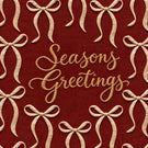 Red fabric with a repeating pattern of beige ribbon bows and the words 'Seasons Greetings' in gold cursive script in the center.
