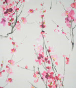 Seville Blossom Stone fabric featuring a delicate watercolour floral print of pink, blush and deep raspberry blossoms on slender grey-green branches against a soft stone background.