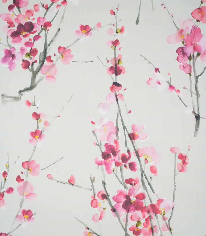 Seville Blossom Stone fabric featuring a delicate watercolour floral print of pink, blush and deep raspberry blossoms on slender grey-green branches against a soft stone background.