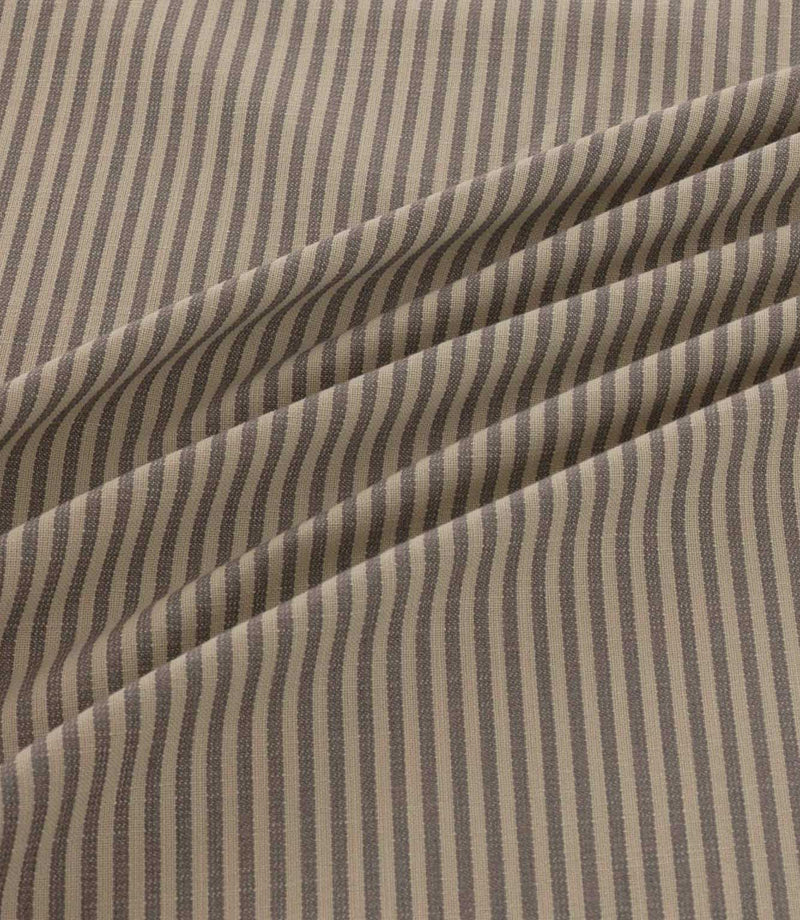Shoreham Rockport striped fabric arranged in soft diagonal folds, showcasing its alternating taupe grey and natural beige ticking stripes, textured woven finish and gentle drape.