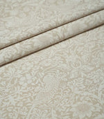 Beige and off-white Strawberry Thief Linen Look fabric arranged in soft folds, showing the repeating William Morris bird, strawberry and floral pattern.