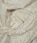 Draped Strawberry Thief Linen Look William Morris fabric in beige and off-white, showing birds amongst strawberries, flowers and dense Arts & Crafts foliage.