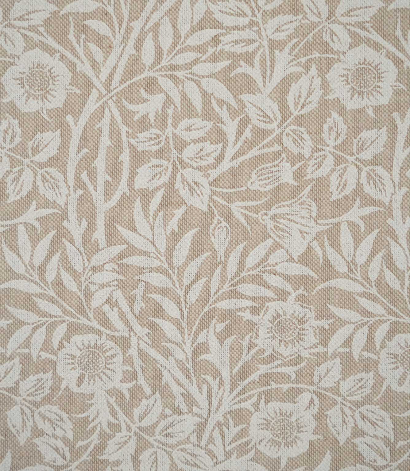 Sweet Briar Linen Look fabric in warm beige and cream, showing a detailed William Morris inspired floral pattern of flowers, leaves and trailing stems.