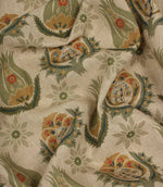 Draped botanical print fabric with stylised flowers and ornamental motifs on a soft natural linen-look ground.