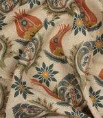 Draped Arts and Crafts style fabric featuring stylised flowers and ornamental botanical motifs on a neutral linen-look ground.